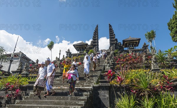 Devout Balinese descend stairs