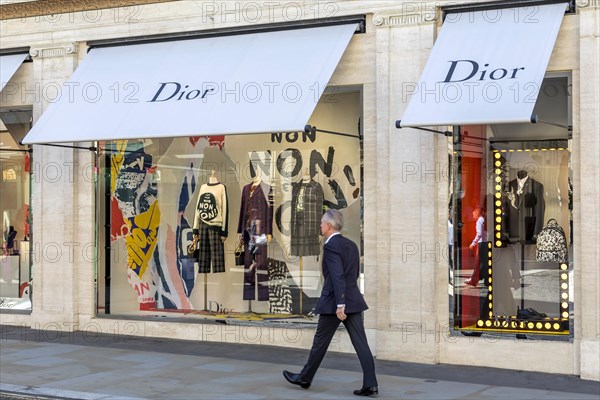 Passer-by in front of shop window