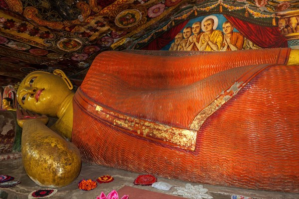 Reclining Buddha statue and painted ceilings