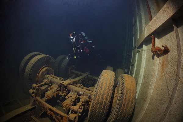 Diver looking at lorry in hold