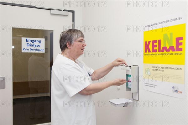 Doctor disinfecting hands against multiresistant bacteria