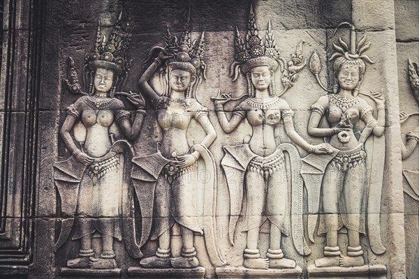 Stone relief of the divine dancers