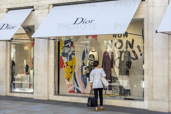 Passer-by in front of shop window