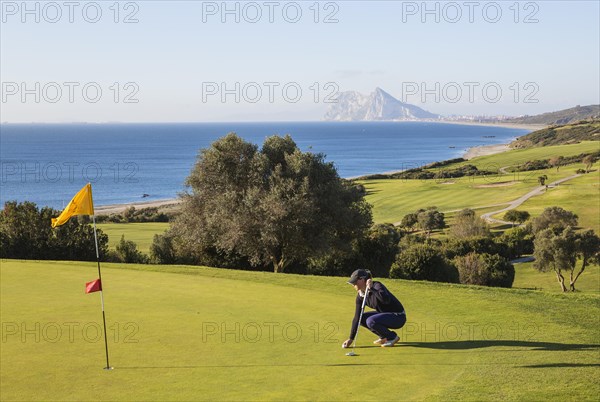 Golfer on putting green