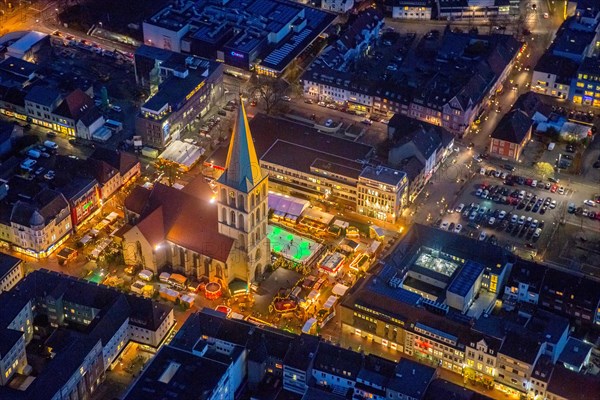 Christmas market with ice rink at St. Paul's church at night