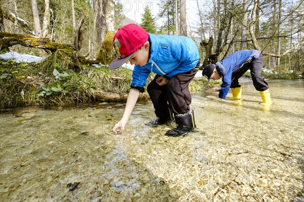 Two boys in a brook