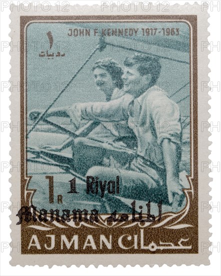 1 Riyal postage stamp with John F. Kennedy and Jacqueline Kennedy sailing