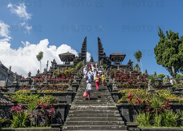 Devout Balinese descend stairs