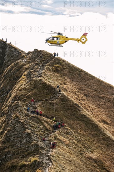 Mountain rescue by helicopter on the Fellhorn ridge