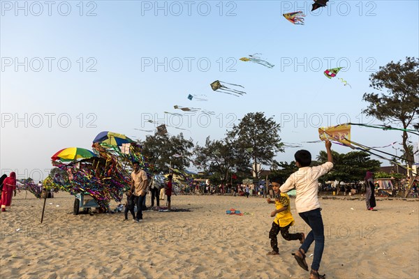 Children flying paper kites