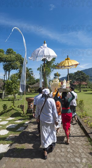 Procession of devout Buddhists with offerings