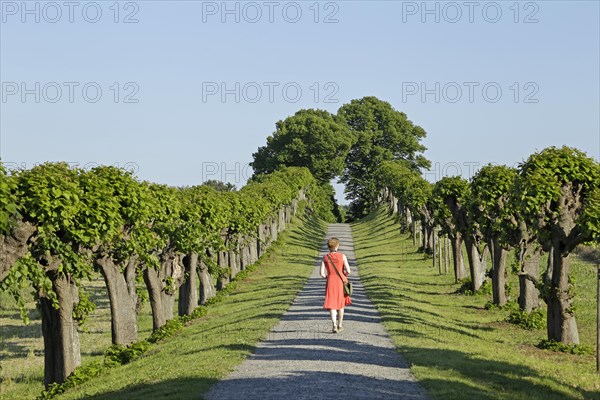 Woman in red dress running on Feston avenue