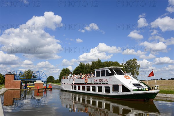 Ship Ostroda at a lock in the Oberlandkanal