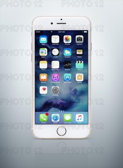 Gold white Apple iPhone 6 6s with desktop icons on display
