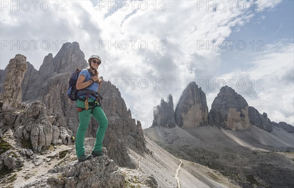 Hiker on the via ferrata to Paternkofel