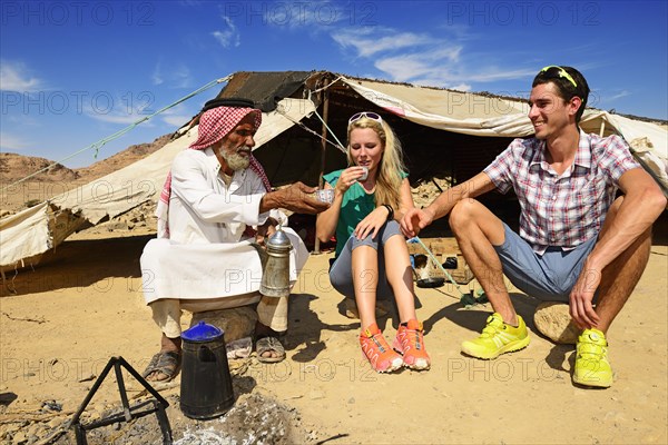 Bedouin preparing coffee with pan-roasted beans and kardamom