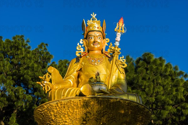 Big golden statue of Padmasambhava at back of Swayambhunath temple