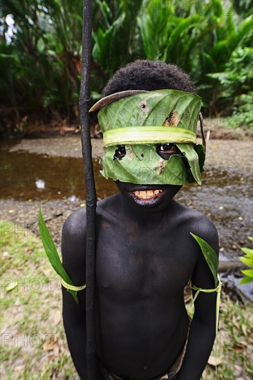 Korafe-child with facial and headdress made of leaves