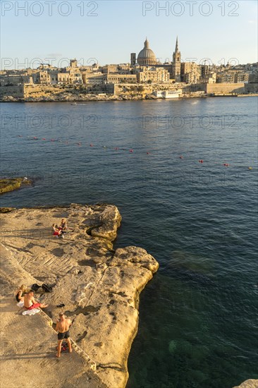 Bathing place on the rocks of Tigne Seafront with city view