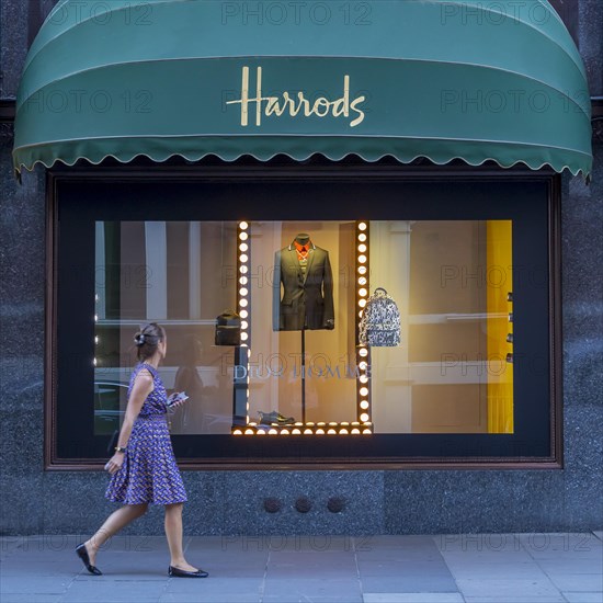 Passer-by in front of a shop window