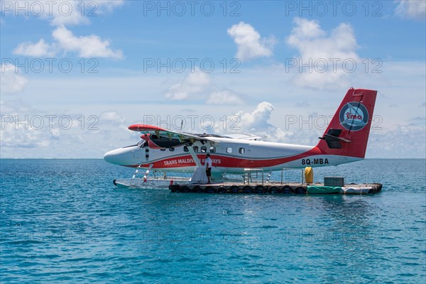 Seaplane at platform in open sea