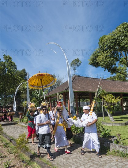 Procession of devout Buddhists with offerings