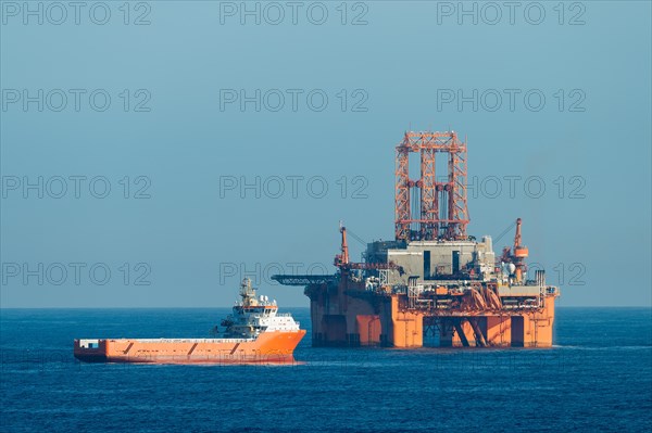 Supply vessel Normand Aurora next to West Phoenix oil rig