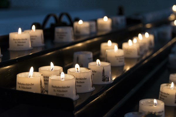 Burning candles in a church