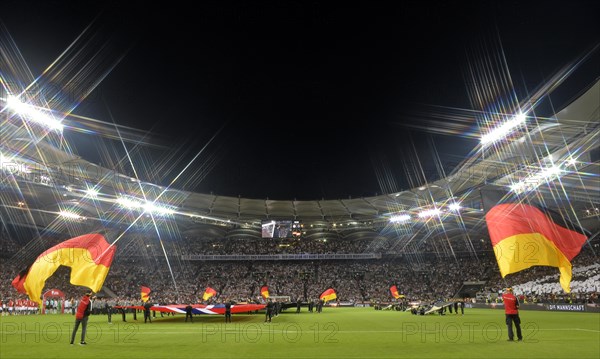 Flag waver with German flags in front of the start of the match