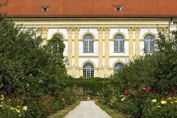 Colorful flower beds in front of castle facade