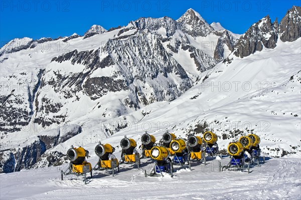 Snow cannons on ski slope