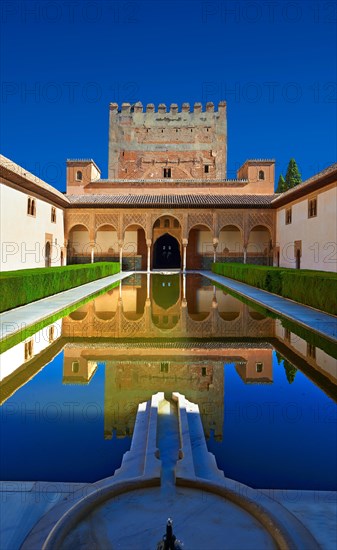 Arabesque Moorish architecture and pond of the Court of the Myrtles of the Palacios Nazaries