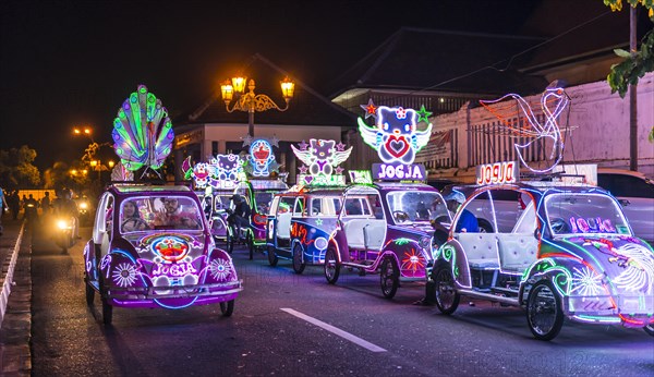 Cars illuminated with colourful LEDs