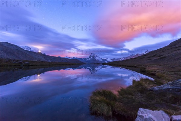 Matterhorn is reflected in the Stellisee at dawn