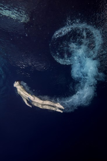 Boy diving into pool