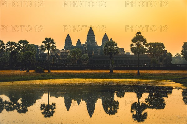 Temple complex of Angkor Wat reflected in the water basin