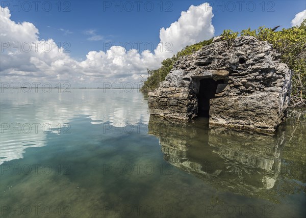 Sunken boulders with water reflection