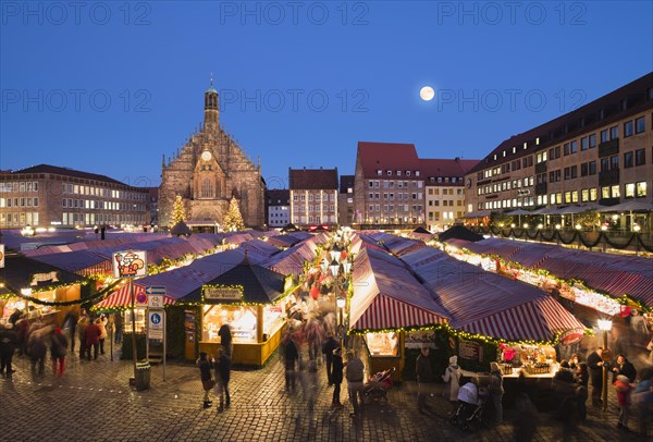 Nuremberg Christmas Market with Church of Our Lady at full moon