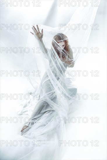 Redhead maiden woman in white cloth