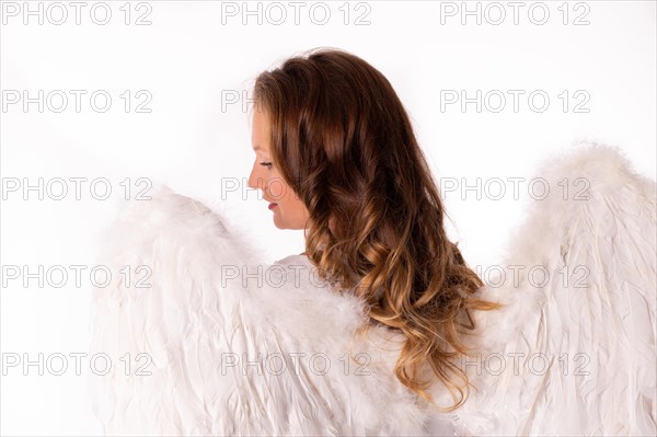 Young woman dressed as angel