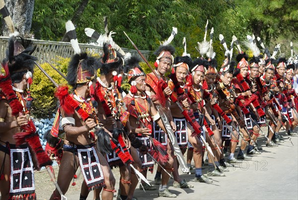 Naga tribal group performers standing in line to welcome Officials at the Hornbill Festival