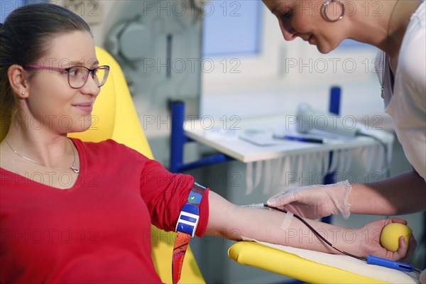 Patient taking a blood sample at the transfusion ward of a hospital