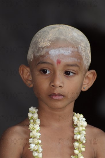 Indian child with flower garland