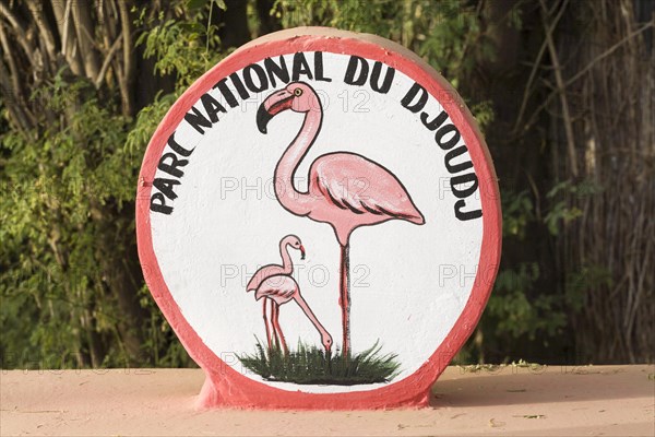 Painted sign with flamingos at entrance to Parc National du Djoudj