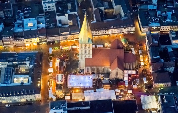 Christmas market with ice rink at St. Paul's church at night