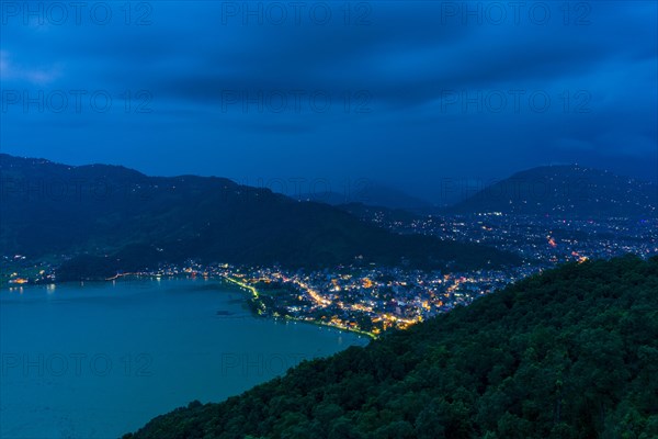 View on the illuminated city and the Phewa Lake at night