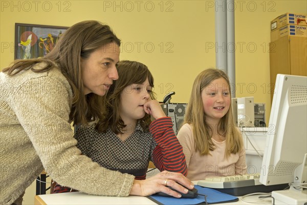 Elementary school girls working in computer room