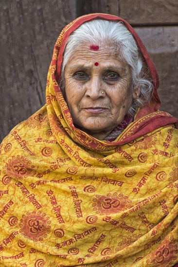 Nepalese woman with nose jewelry and headscarf