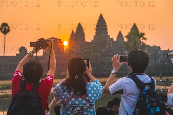 Tourists take pictures Angkor Wat