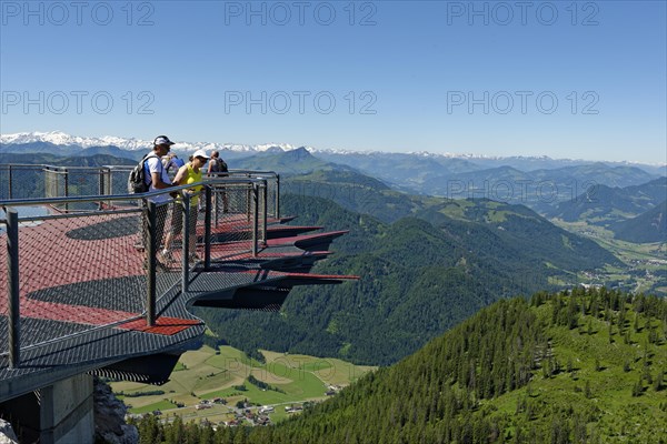Tourists looking over the edge of the viewing platform